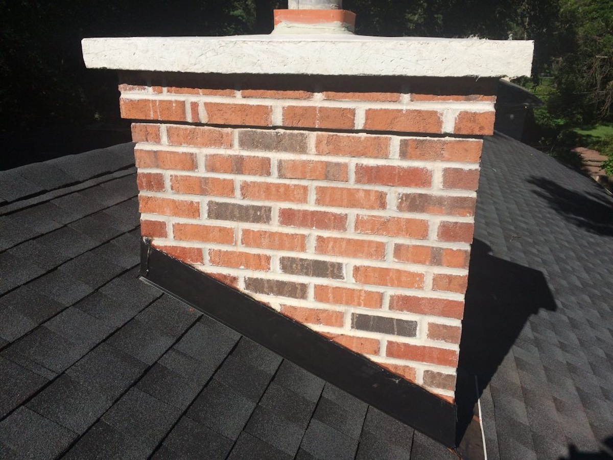 Chimney with new concrete cap